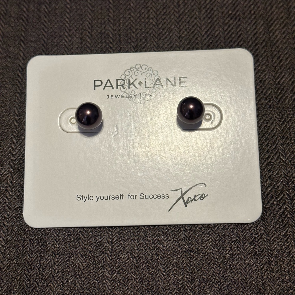 Round purple glass stud earrings by Park Lane.